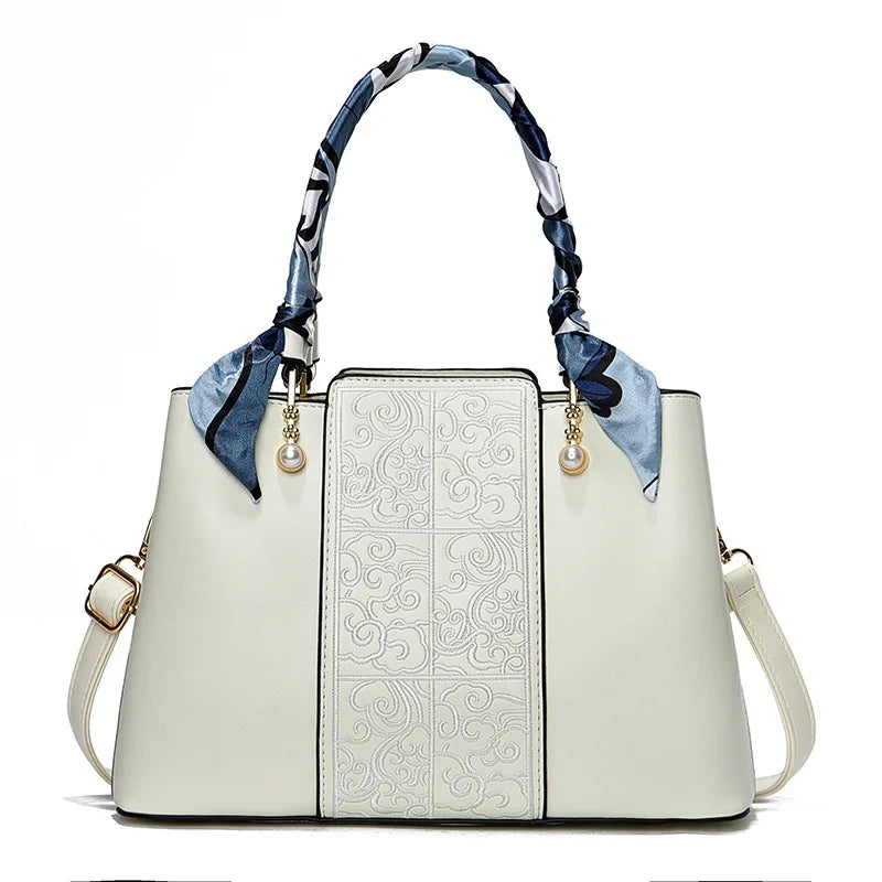 Chic Embossed Leather Handbag with Decorative Scarf Handle