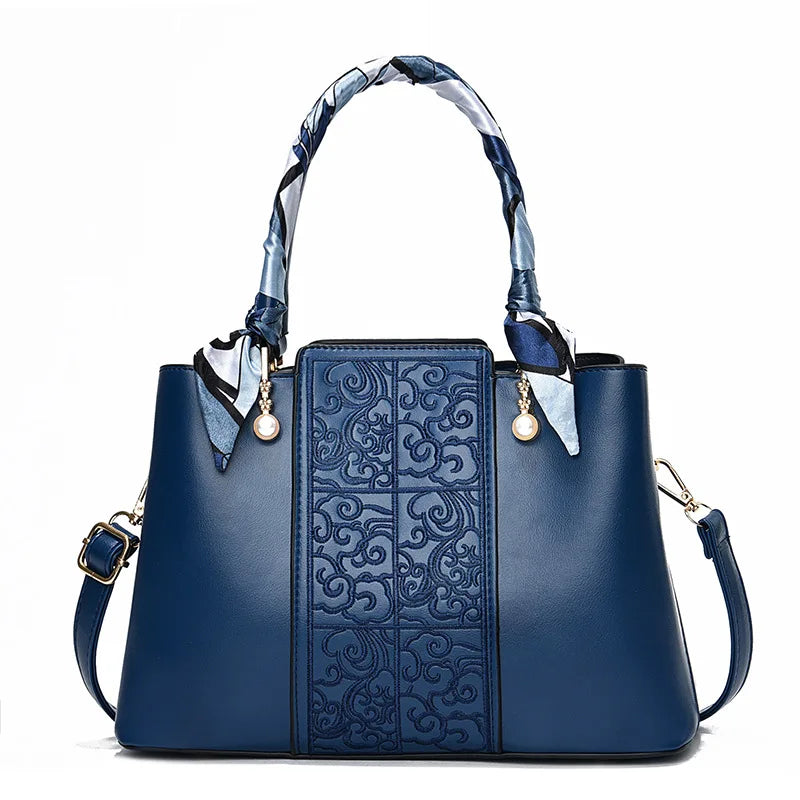 Chic Embossed Leather Handbag with Decorative Scarf Handle