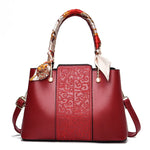 Chic Embossed Leather Handbag with Decorative Scarf Handle