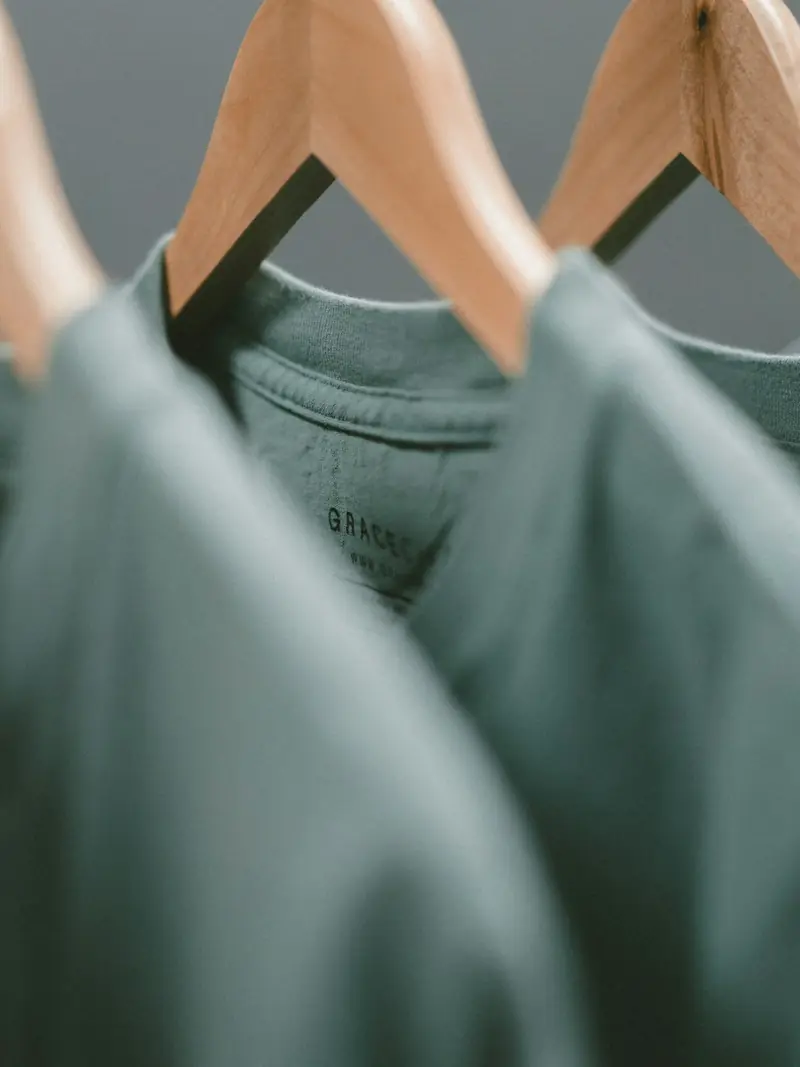 Green shirts on hangers