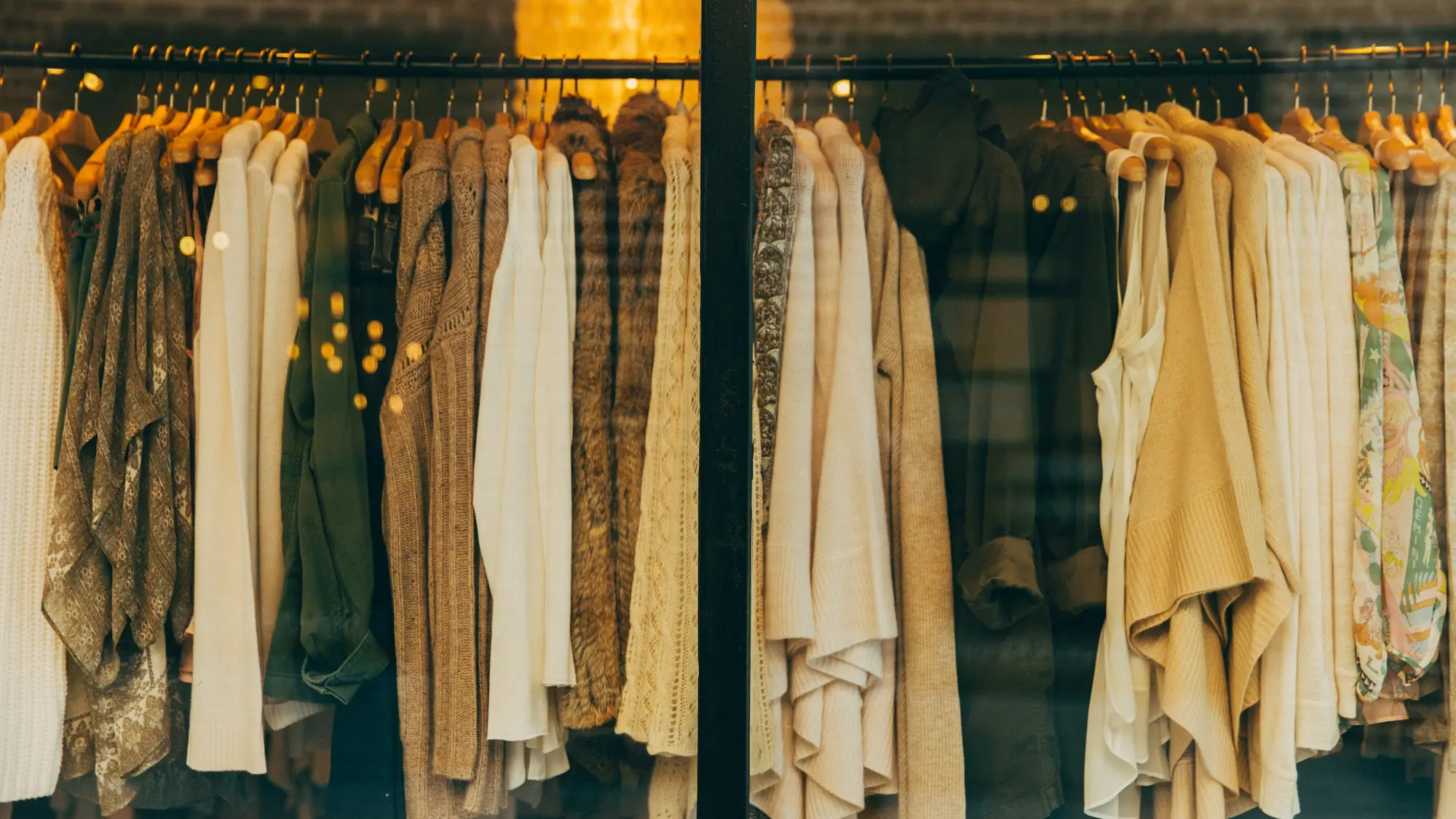 Rails of clothes in warm light